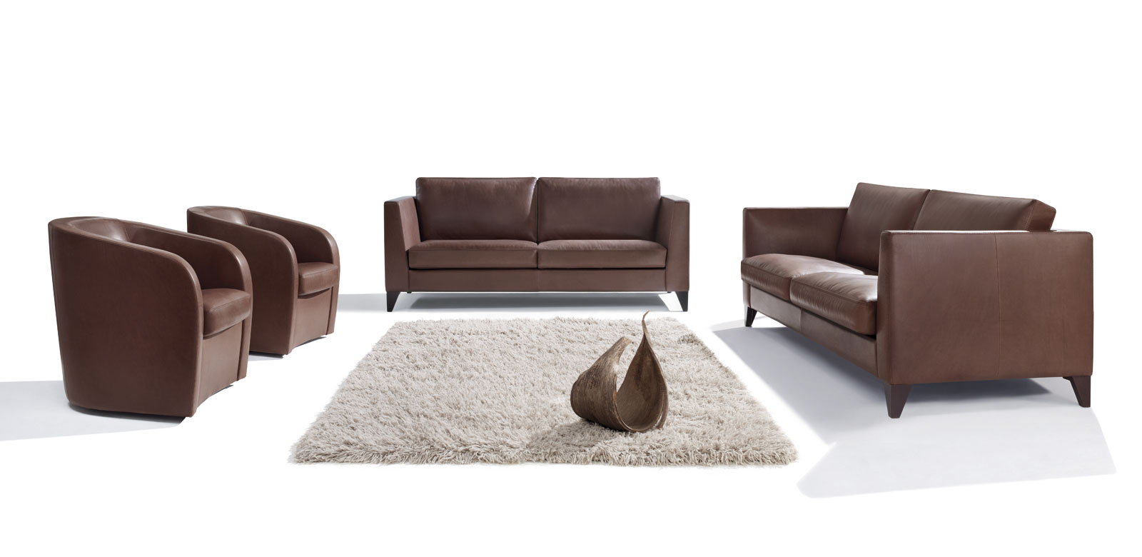 Two CL850 sofas in brown leather with matching armchairs