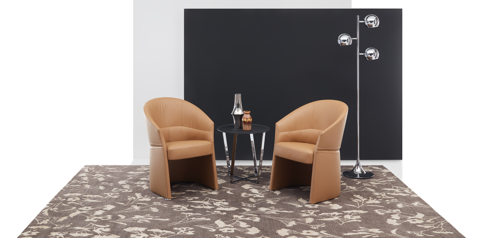 Armchair CL128 in light brown leather on decorated dark brown carpet