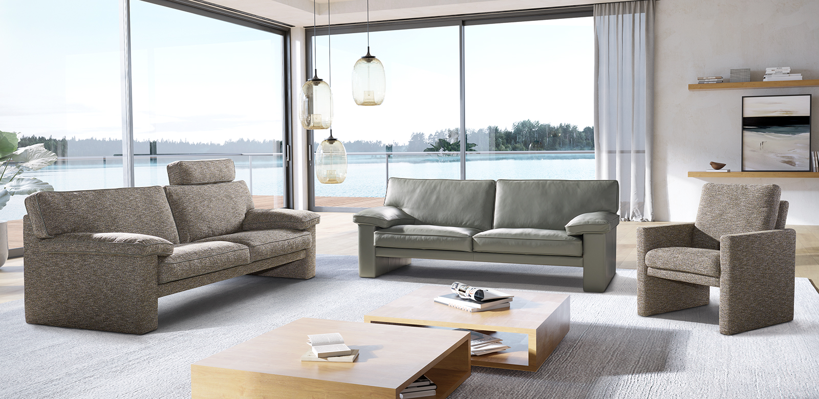 CL360 furniture combination of 2,5-seater and armchair in grey-brown fabric and 2,5-seater in grey-green leather in modern living room by the lake.
